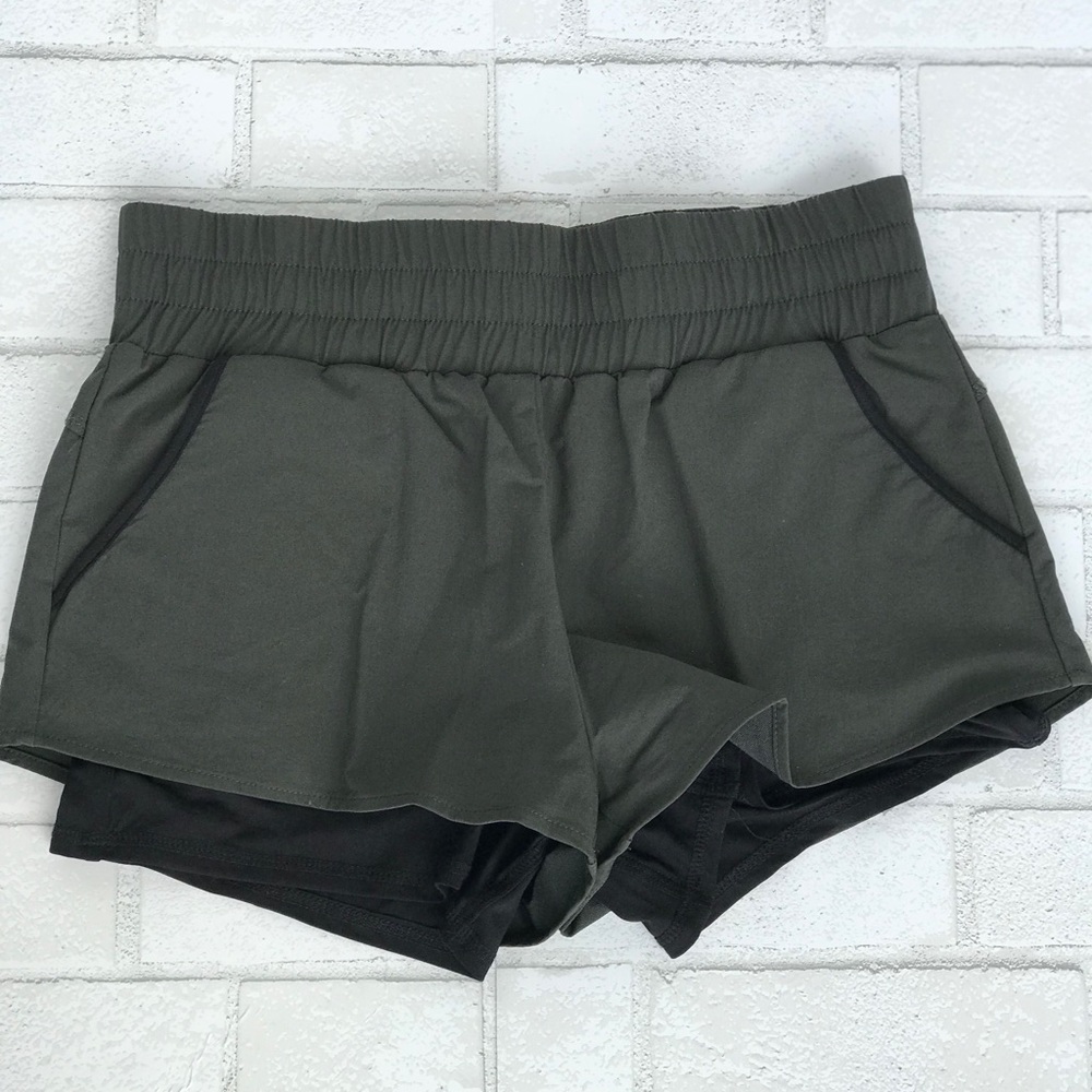 Army green nylon shorts with built in spandex
